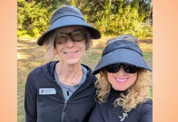 Two woman from the YMCA getting ready to lead a group hike