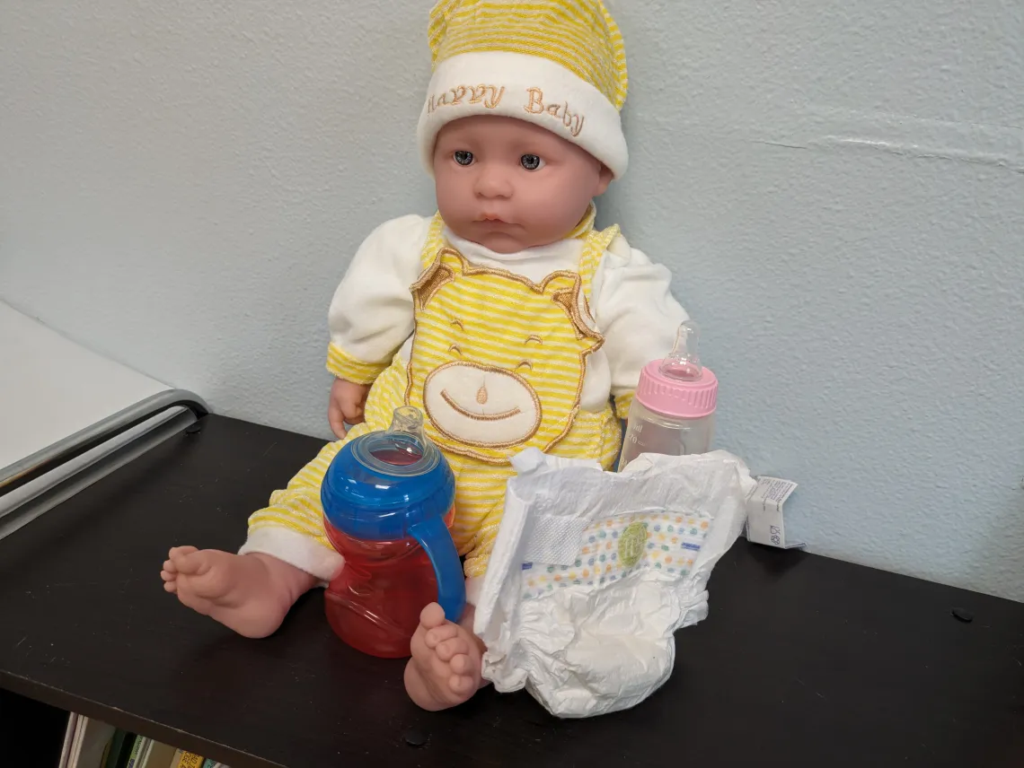 Baby training doll for babysitting training